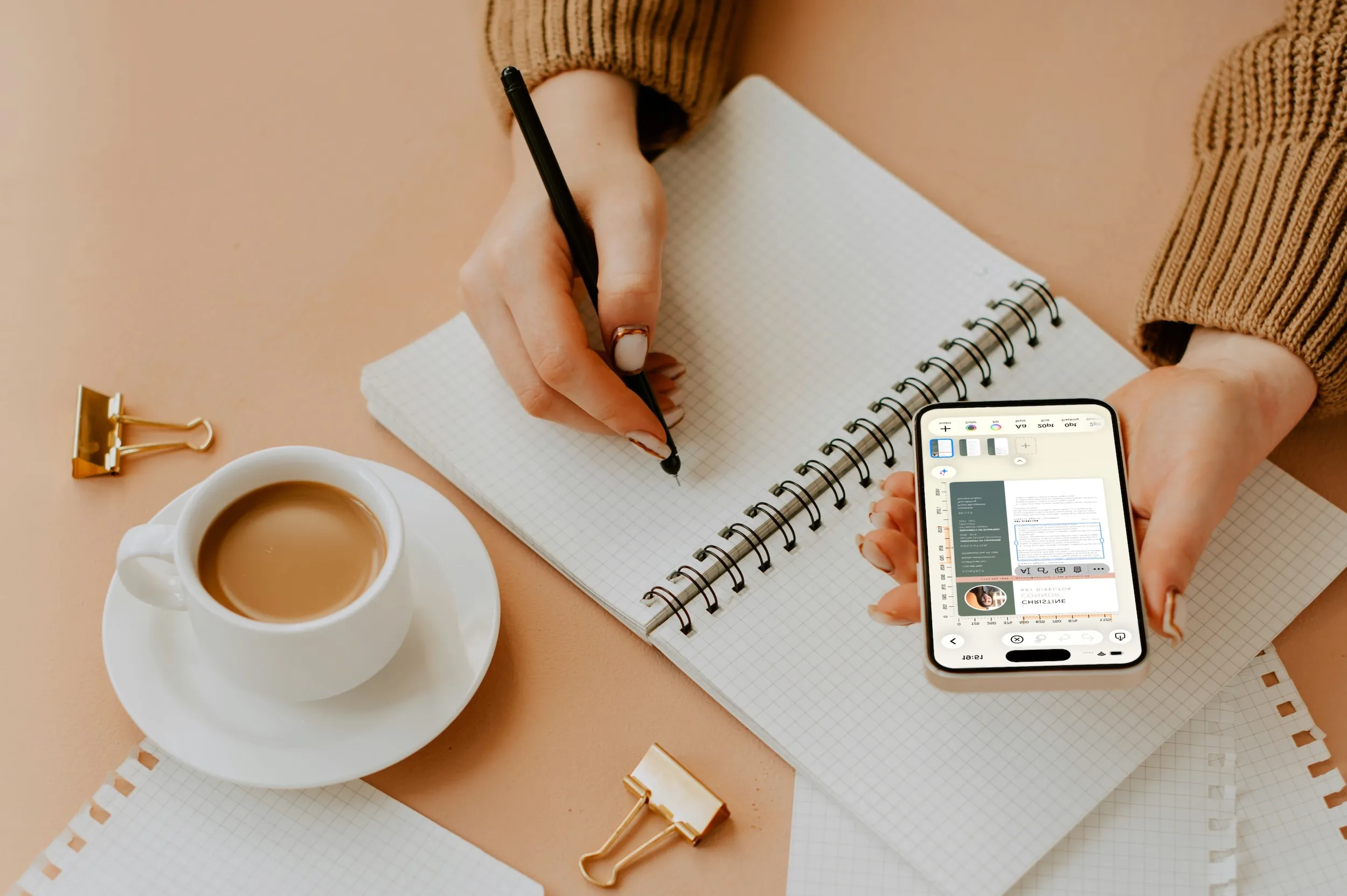 Editing a Pixara document on iPhone, with a pen and coffee on the desk
